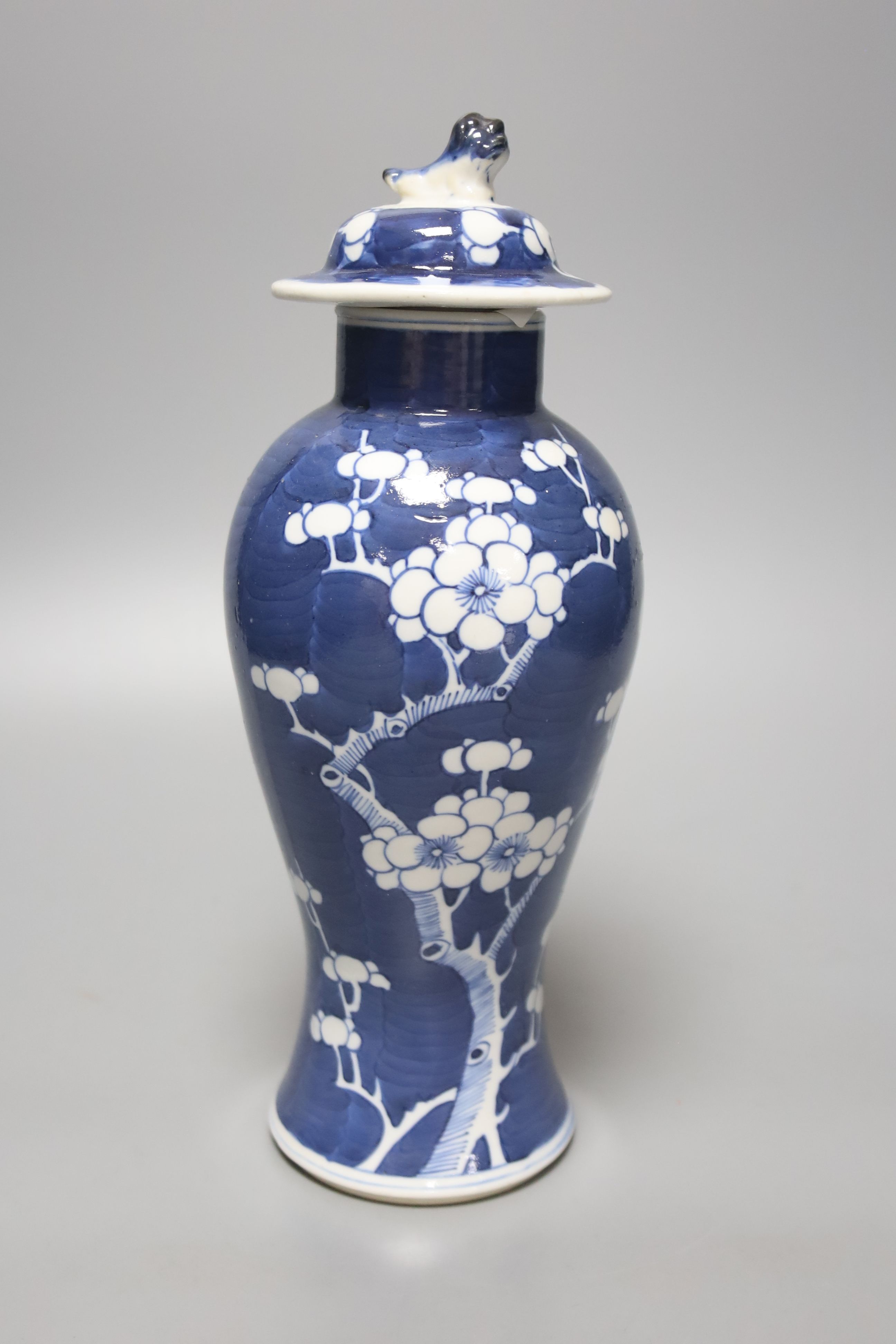 A Chinese blue and white vase and cover, a pair of famille rose jars and covers and two other jars and covers, tallest 27cm